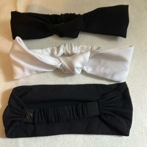 Lululemon head bands, 1 white with knot, 1 black with knot, 1 plain black